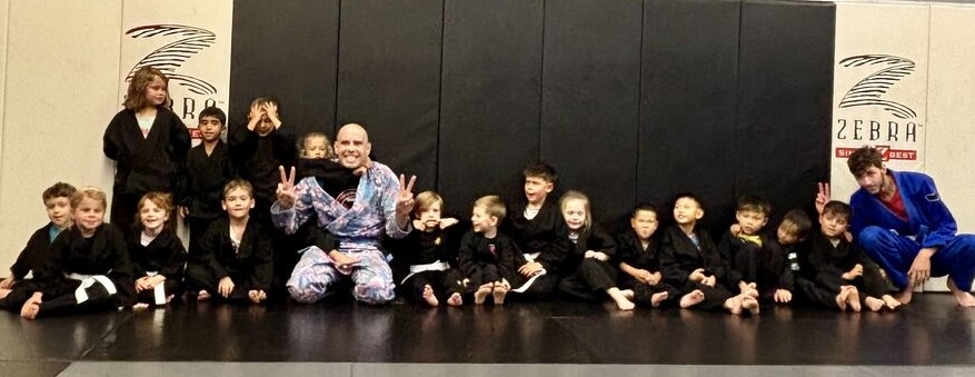 A Tiny Ninjas class group photo on the mats at Rumble Martial Arts.