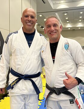 Professor Jones in his black belt gi with Royce Gracie in Brazil, Royce wearing a blue belt signed by Helio Gracie.