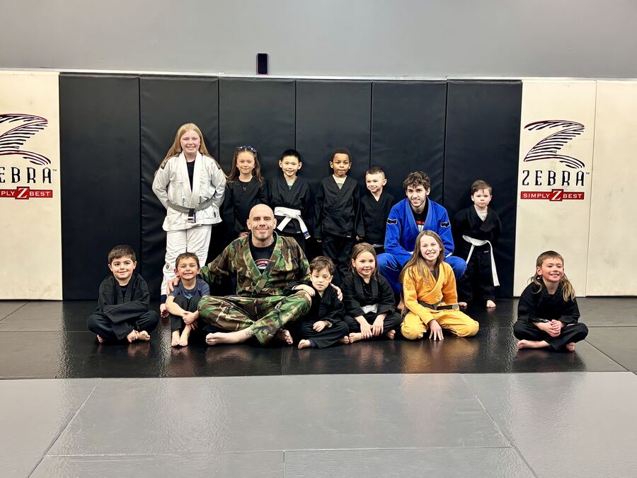 A Tiny Ninjas class group photo on the mats at Rumble Martial Arts.